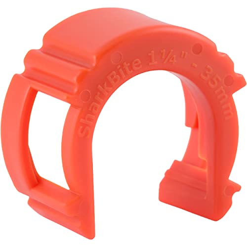 Red Sharkbite push-to-connect disconnect tool with 1-1/4 inch opening and grip handles.