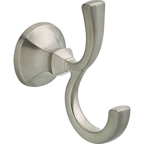 Brushed nickel robe hook with curved double hooks mounted on round wall plate.