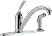 Chrome single handle kitchen faucet with curved spout and detachable spray head on deck plate.