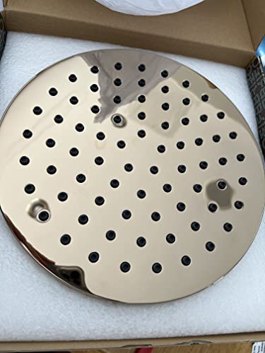 Round brushed nickel shower head with evenly spaced perforations, mounted on white packaging material in box.
