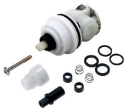 White and black Delta cartridge assembly with metal valve stem, rubber seals, springs, and mounting hardware displayed separa