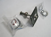 Watts RPZ 909 repair kit containing metal spring assembly, black plastic valve body, threaded bolt, and small packaged rubber