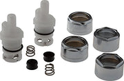Two plastic stem cartridges with metal caps, springs, black seals, and chrome-finished bonnet nuts displayed as a kit.