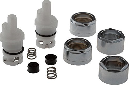 Two plastic stem cartridges with metal caps, springs, black seals, and chrome-finished bonnet nuts displayed as a kit.