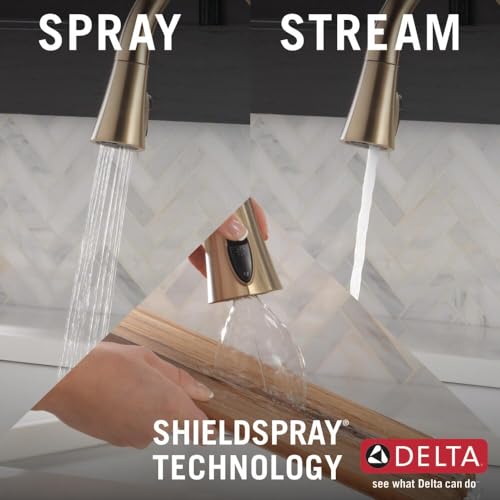 Bronze single-handle pull-down kitchen faucet with spray and stream water settings over marble countertop.