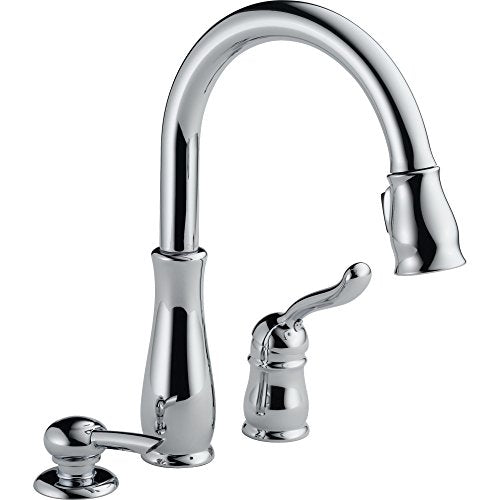 Chrome pull-down kitchen faucet with single lever handle and separate soap dispenser pump.