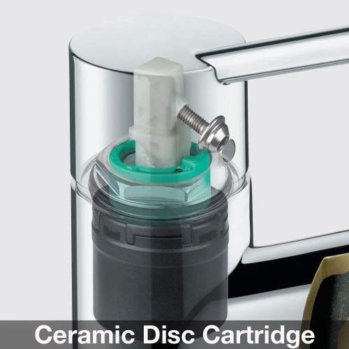 Chrome bar faucet cartridge with ceramic disc, green and black internal components visible through clear housing.