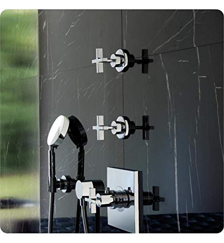 Chrome volume control trim with cross handles mounted on dark marble wall with handheld shower and hose.