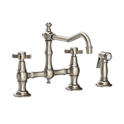 Antique nickel bridge kitchen faucet with curved spout, cross handles, and separate side spray attachment.