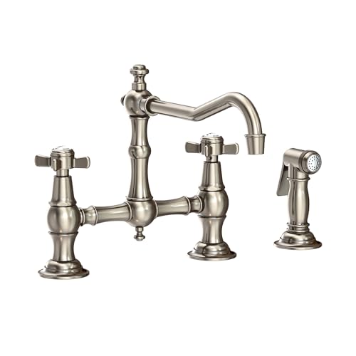 Antique nickel bridge kitchen faucet with curved spout, cross handles, and separate side spray attachment.