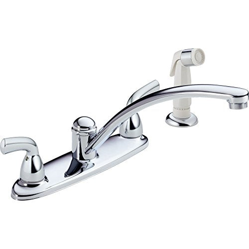 Chrome two-handle kitchen faucet with curved spout and detachable spray head.