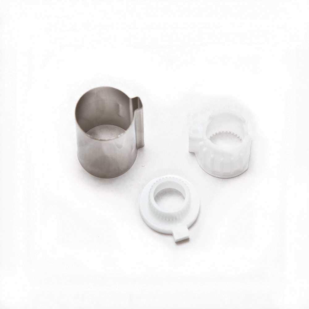 Moen Posi-Temp stop tube replacement kit with metal sleeve and two white plastic components.