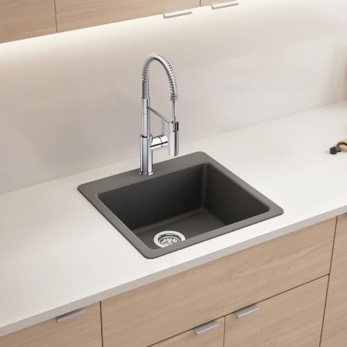 Cinder-colored single bowl undermount kitchen sink with chrome pull-down faucet and strainer.