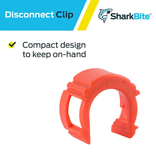 Red plastic Sharkbite disconnect clip tool with curved handle and grip tabs for 1-1/4 inch push-to-connect fittings.