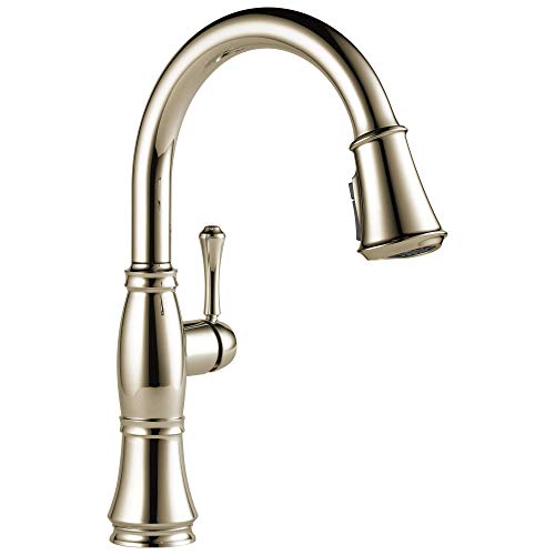 Chrome kitchen faucet with curved spout, single lever handle, and pull-down spray head in brushed nickel finish.