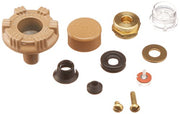 Vacuum breaker repair kit containing brass and rubber components including valve seat, cap, springs, washers, and screws.