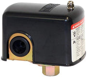 Black cylindrical pressure switch with gold-trimmed opening and brass port fitting on bottom.