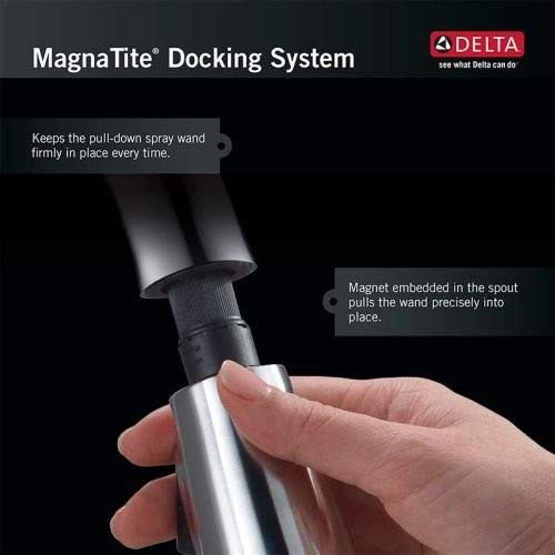 Chrome kitchen faucet spout assembly with pull-down spray wand and MagnaTite docking system.