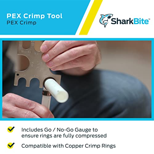 Hand using SharkBite PEX crimp tool with white fitting and metal gauge insert.