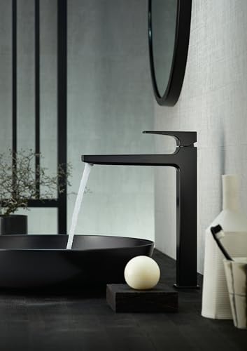 Matte black single-hole bathroom faucet with lever handle and tall spout positioned above a black sink.