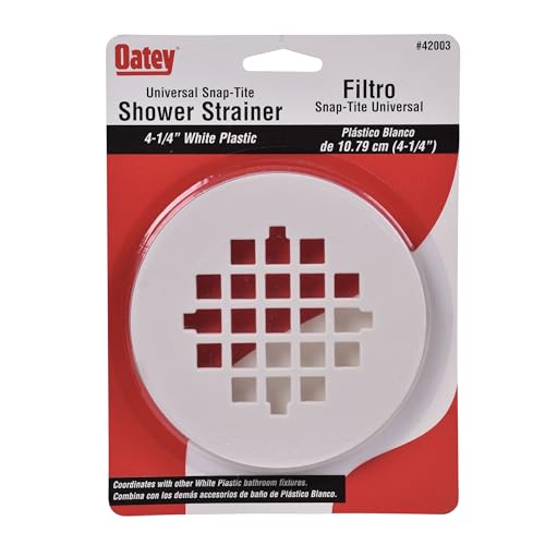 White plastic round shower strainer with square grid drainage holes, 4-1/4 inches diameter.