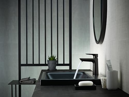 Matte black single-hole faucet with angular handle positioned above a rectangular black sink in a modern bathroom vanity setu