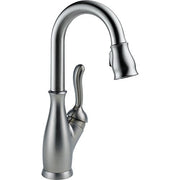 Chrome single-handle faucet with curved spout and pull-down spray head.