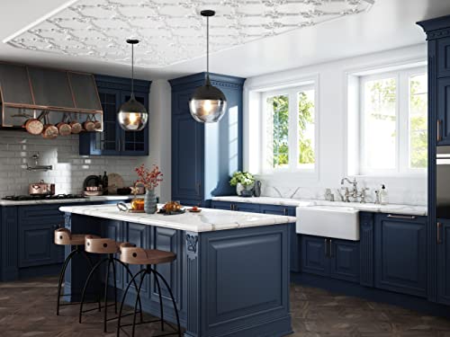 Unlacquered brass pot filler faucet with dual swing arms mounted above kitchen island sink.