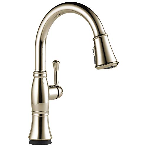 Chrome pull-down kitchen faucet with curved spout, single lever handle, and spray head in extended position.