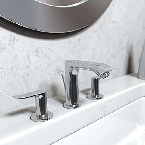 Chrome widespread bathroom faucet with curved spout and two handles mounted on white sink.