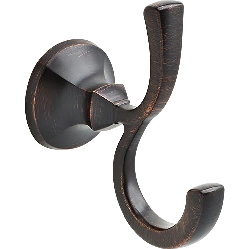 Oil-rubbed bronze double robe hook with curved hooks extending from circular wall-mounted base.