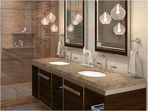 Satin nickel widespread lavatory faucet with curved spout installed on double sink bathroom vanity.