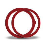 Red rubber toilet flush valve seal rings stacked together.