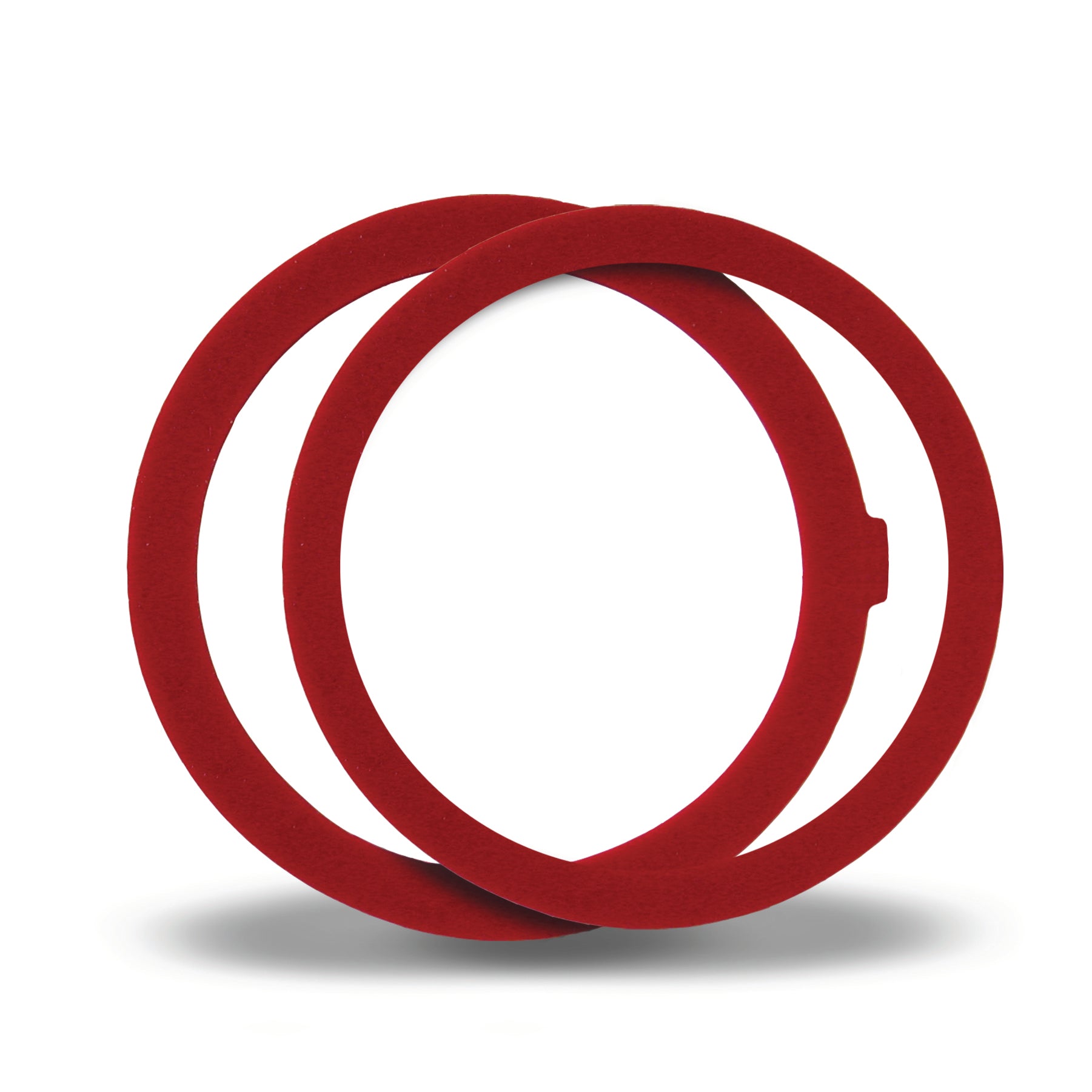 Red rubber toilet flush valve seal rings stacked together.