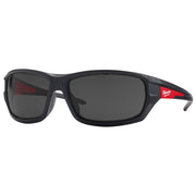 Black safety glasses with tinted lenses and red accents on the temples with Milwaukee branding.