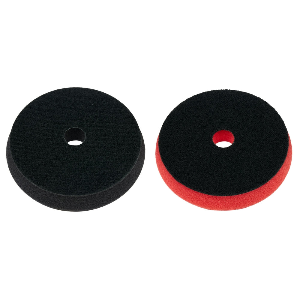 Two 5-inch foam polishing pads, one black and one red, each with center mounting hole.