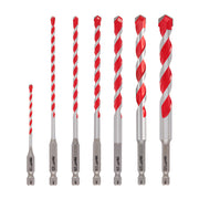 Seven carbide hammer drill bits in increasing sizes with red and gray coloring and hex shanks, arranged left to right.