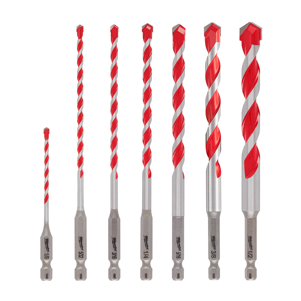 Seven carbide hammer drill bits in increasing sizes with red and gray coloring and hex shanks, arranged left to right.