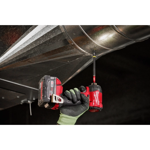 Steel hawg cutter with quick change tang drive, 1-7/8 in. diameter, held in gloved hand during cutting operation.