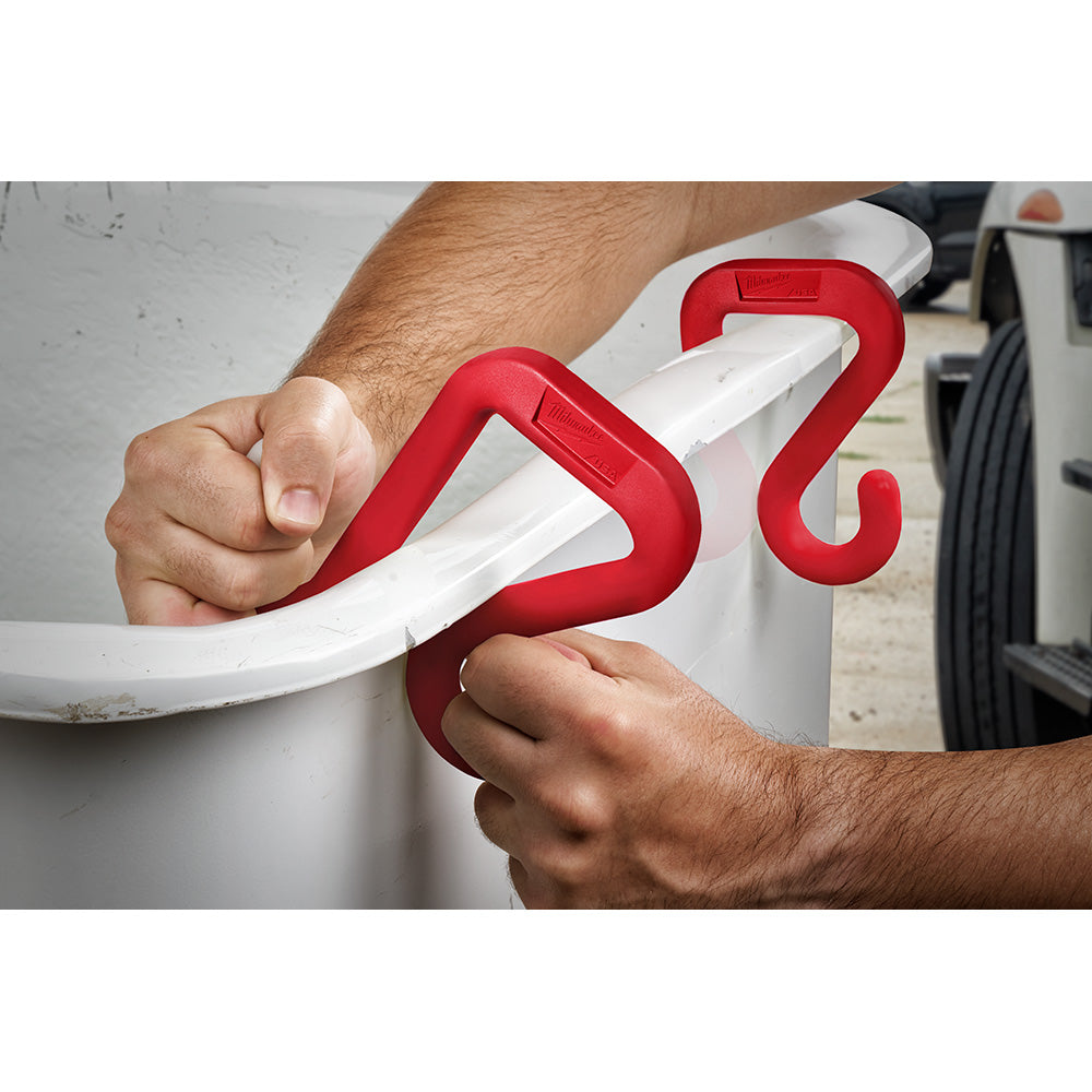 Red and white plastic bucket hook with curved design, shown attached to a white bucket rim.