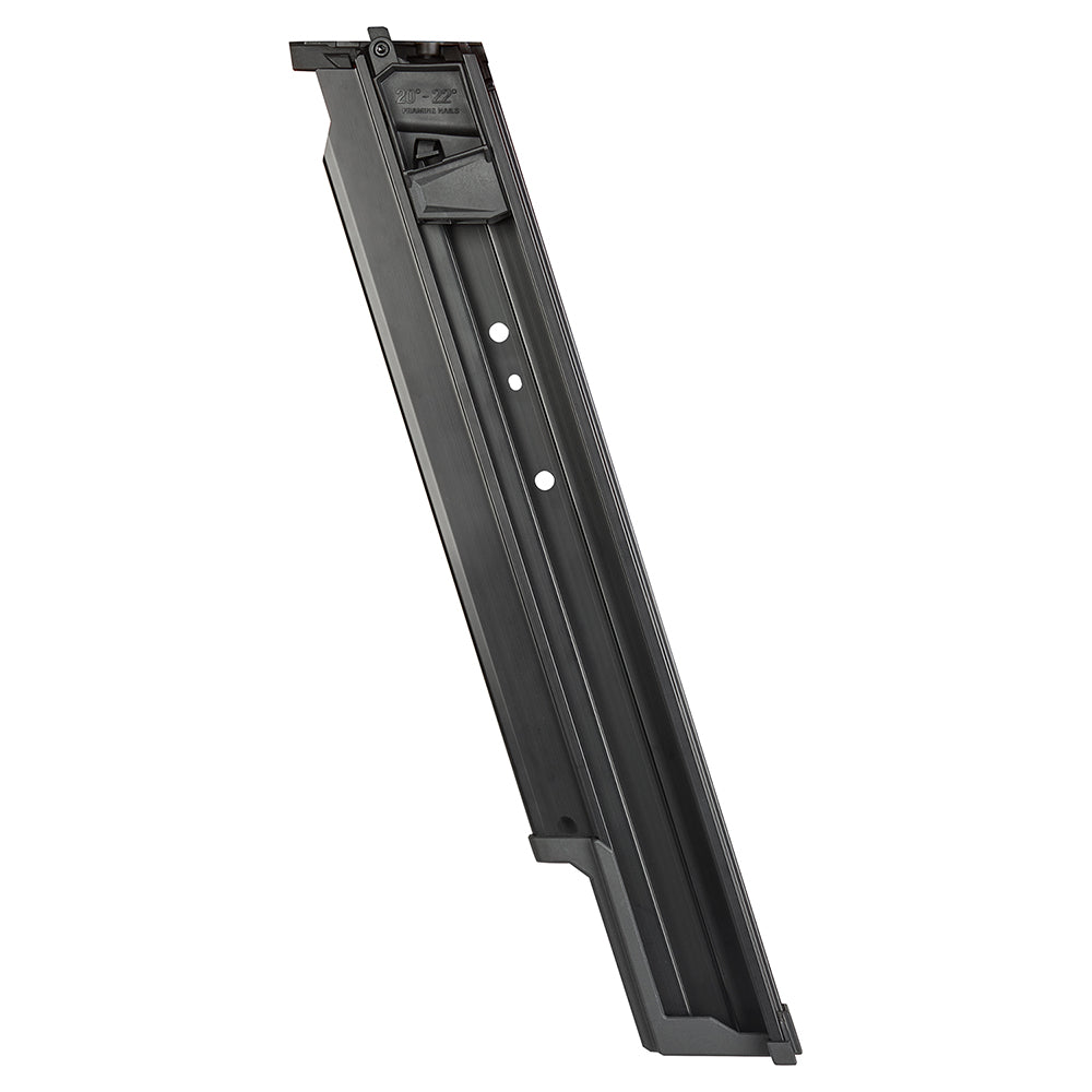 Black plastic magazine assembly with loading chamber and three white adjustment dots on the side.