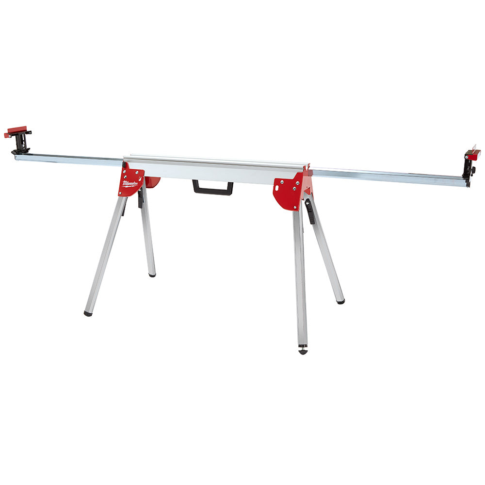 Red and silver folding miter saw stand with aluminum rails, red clamps on each end, and gray adjustable legs.