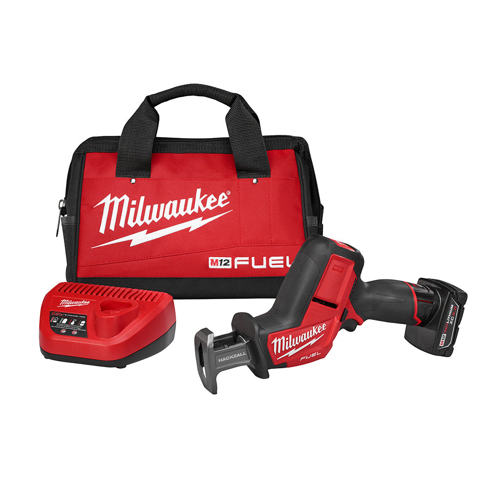 Milwaukee M12 FUEL reciprocating saw kit with red and black charger, battery, and carrying bag.