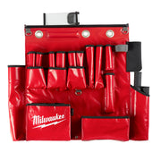 Red tool apron with multiple pockets, metal grommets, black straps, and Milwaukee branding on front pocket.