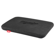 Black rectangular kneeling pad with Milwaukee logo and red label on corner.