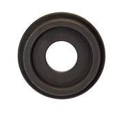 Dark metal circular die spacer with concentric rings and center hole.