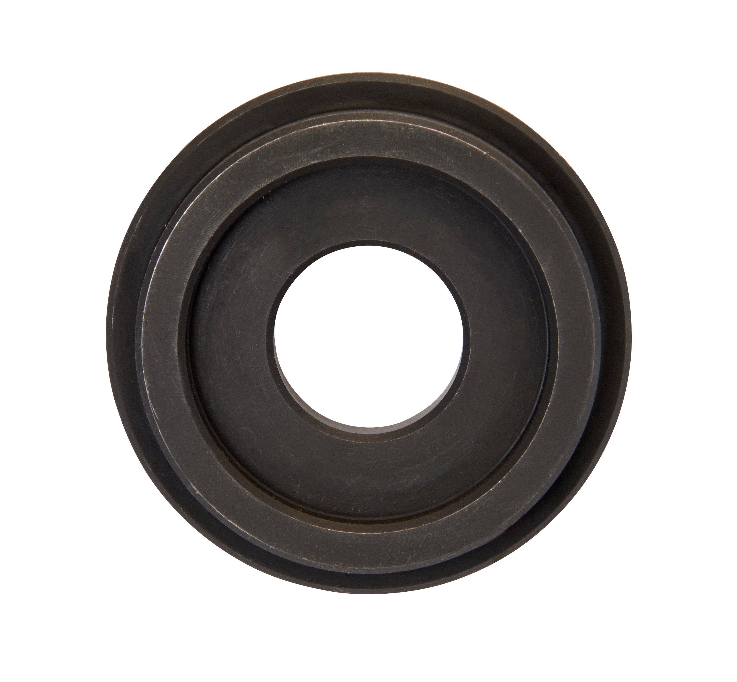 Dark metal circular die spacer with concentric rings and center hole.