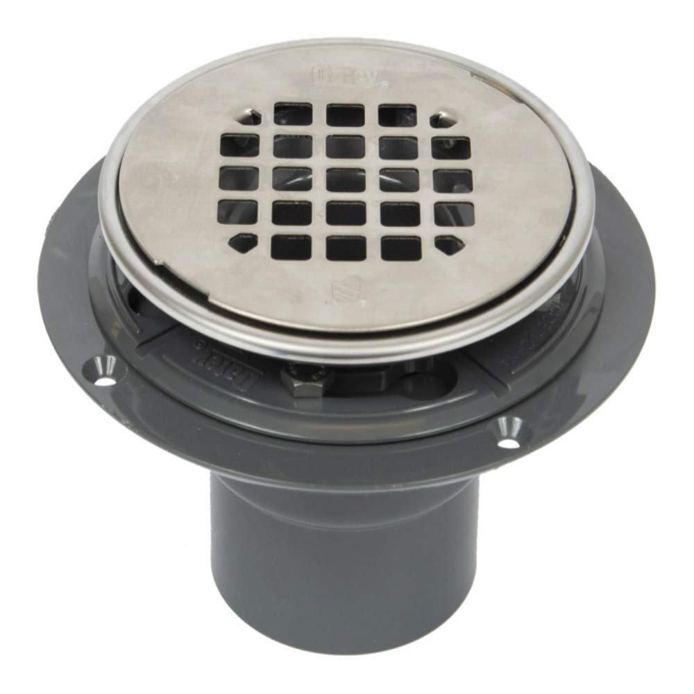 Polished stainless steel shower drain with rectangular strainer pattern and gray PVC base collar.