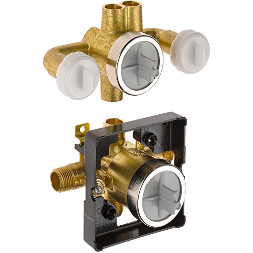 Brass shower valve rough-in with three white handle knobs and central diverter, shown with separate black mounting body assem