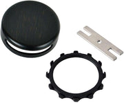 Oil rubbed bronze bathtub overflow faceplate kit with round cover, black retaining ring, and installation bracket.
